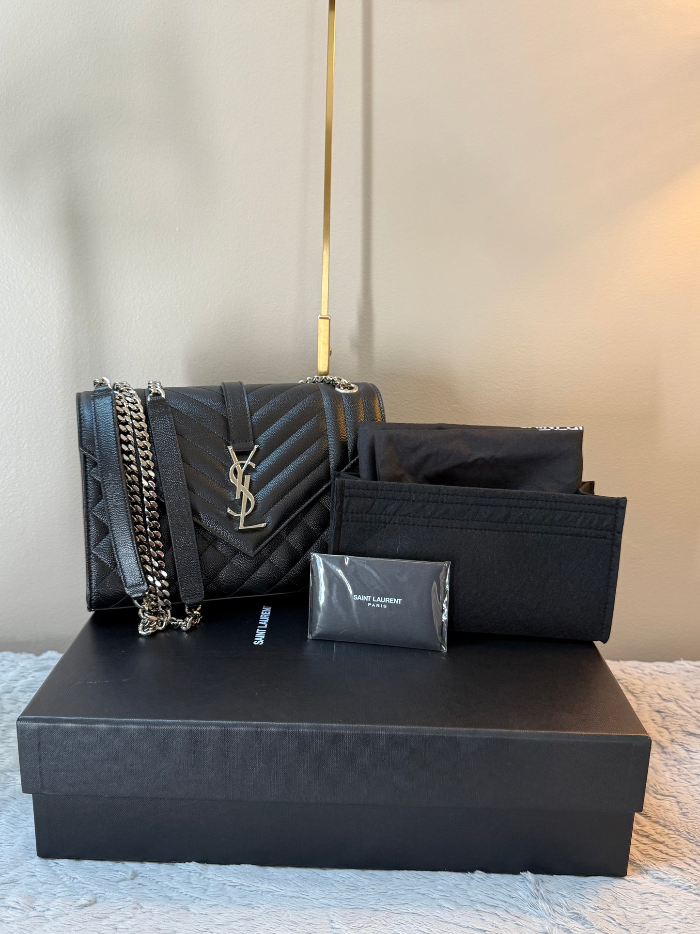 SAINT LAURENT
Envelope Triquilt Medium YSL Shoulder Bag in Grained Leather