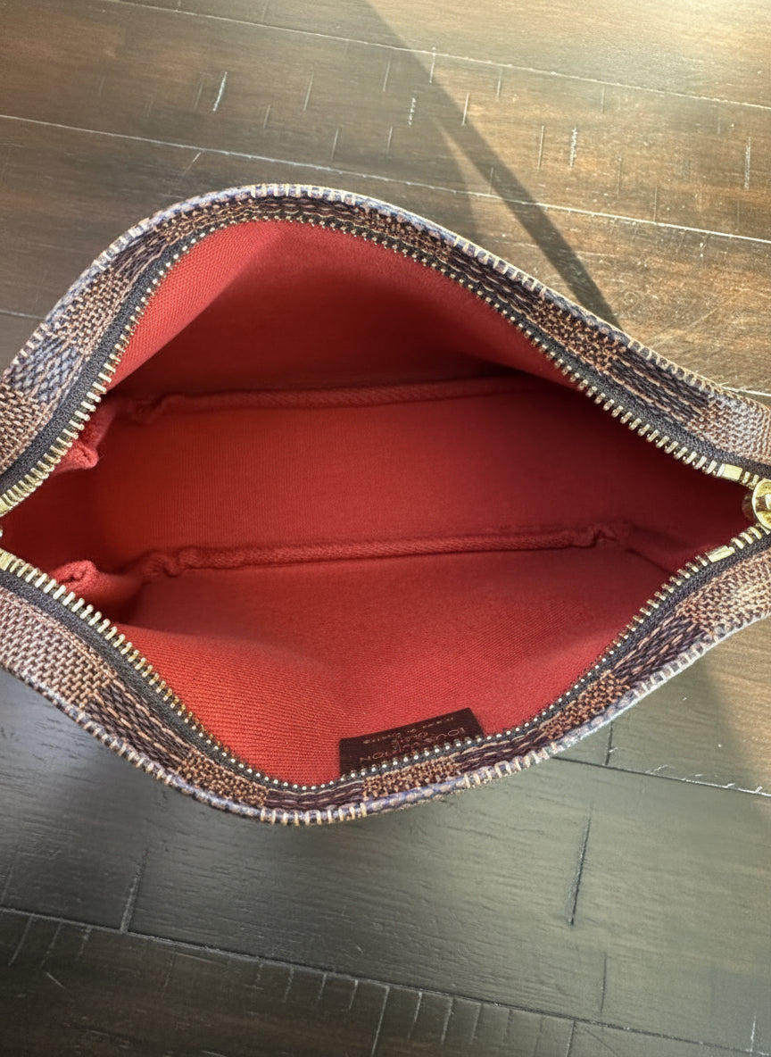 Louis Vuitton
Damier Ebene Trousse Pochette- great gift!