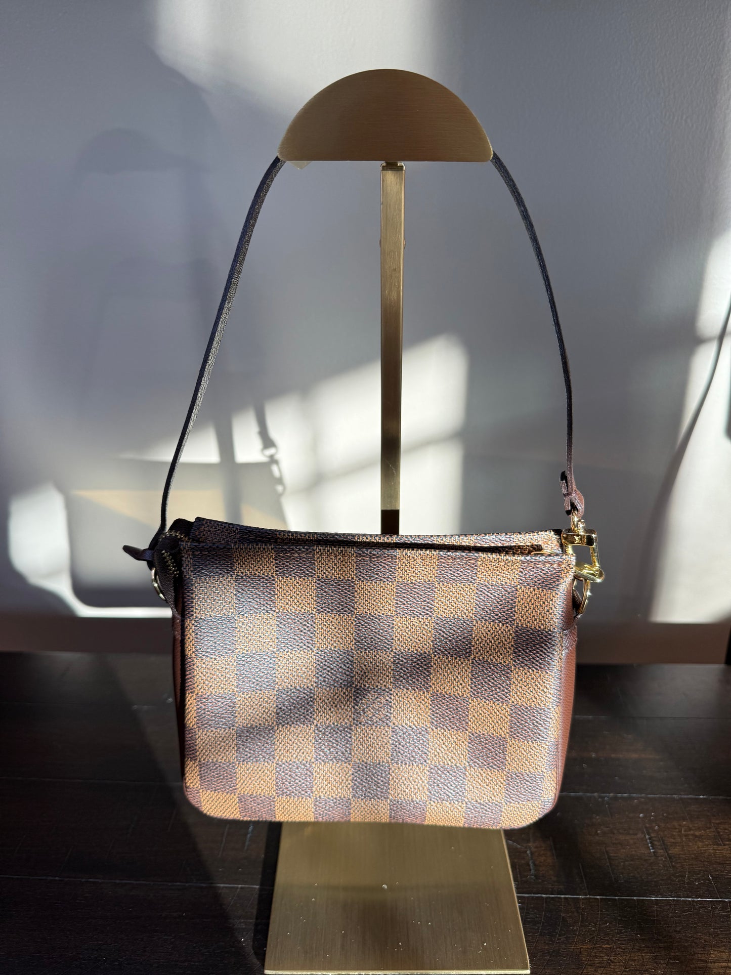 Louis Vuitton
Damier Ebene Trousse Pochette- great gift!