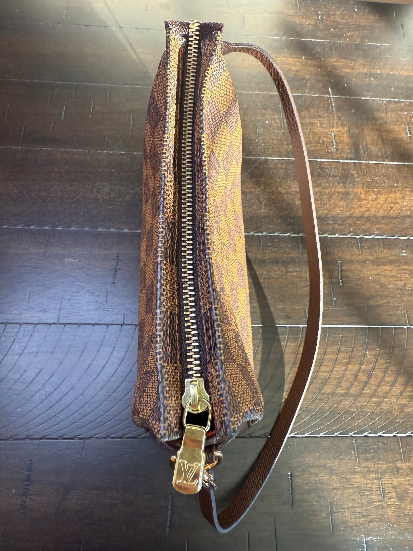 Louis Vuitton
Damier Ebene Trousse Pochette- great gift!