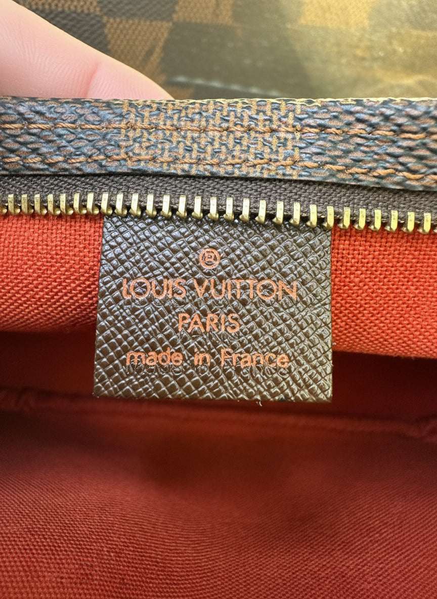 Louis Vuitton
Damier Ebene Trousse Pochette- great gift!