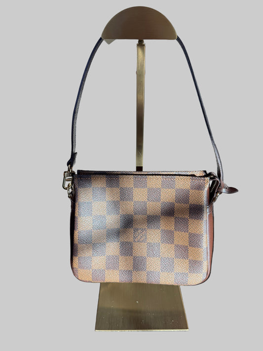 Louis Vuitton
Damier Ebene Trousse Pochette- great gift!