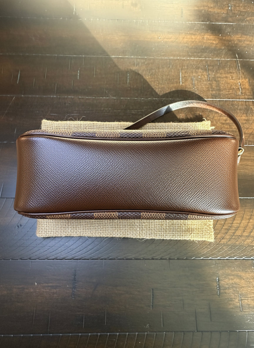 Louis Vuitton
Damier Ebene Trousse Pochette- great gift!